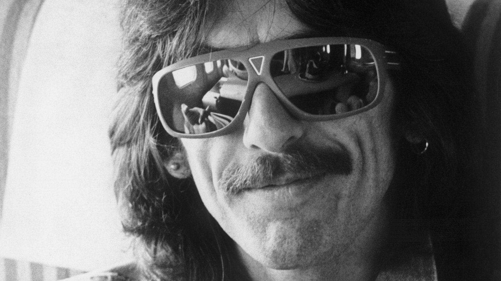 George Harrison wearing big sunglasses